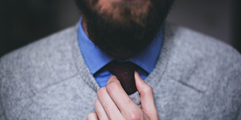 recruiting for a director of development tips visual of man tightening his tie