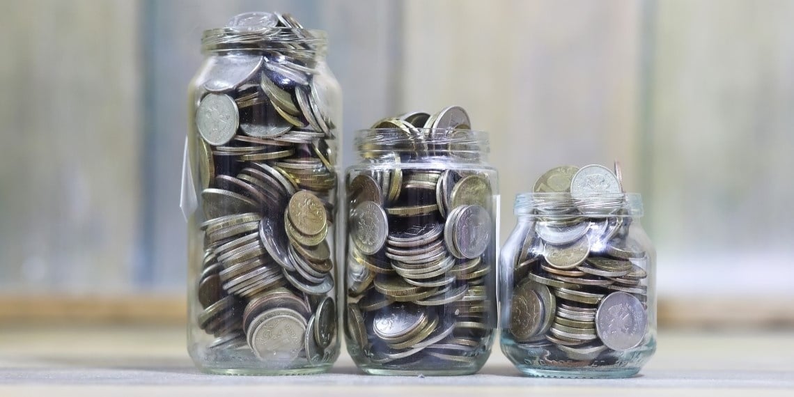 Fractional Major Gifts Officer (MGO) service for nonprofits represented by three jars filled with coins