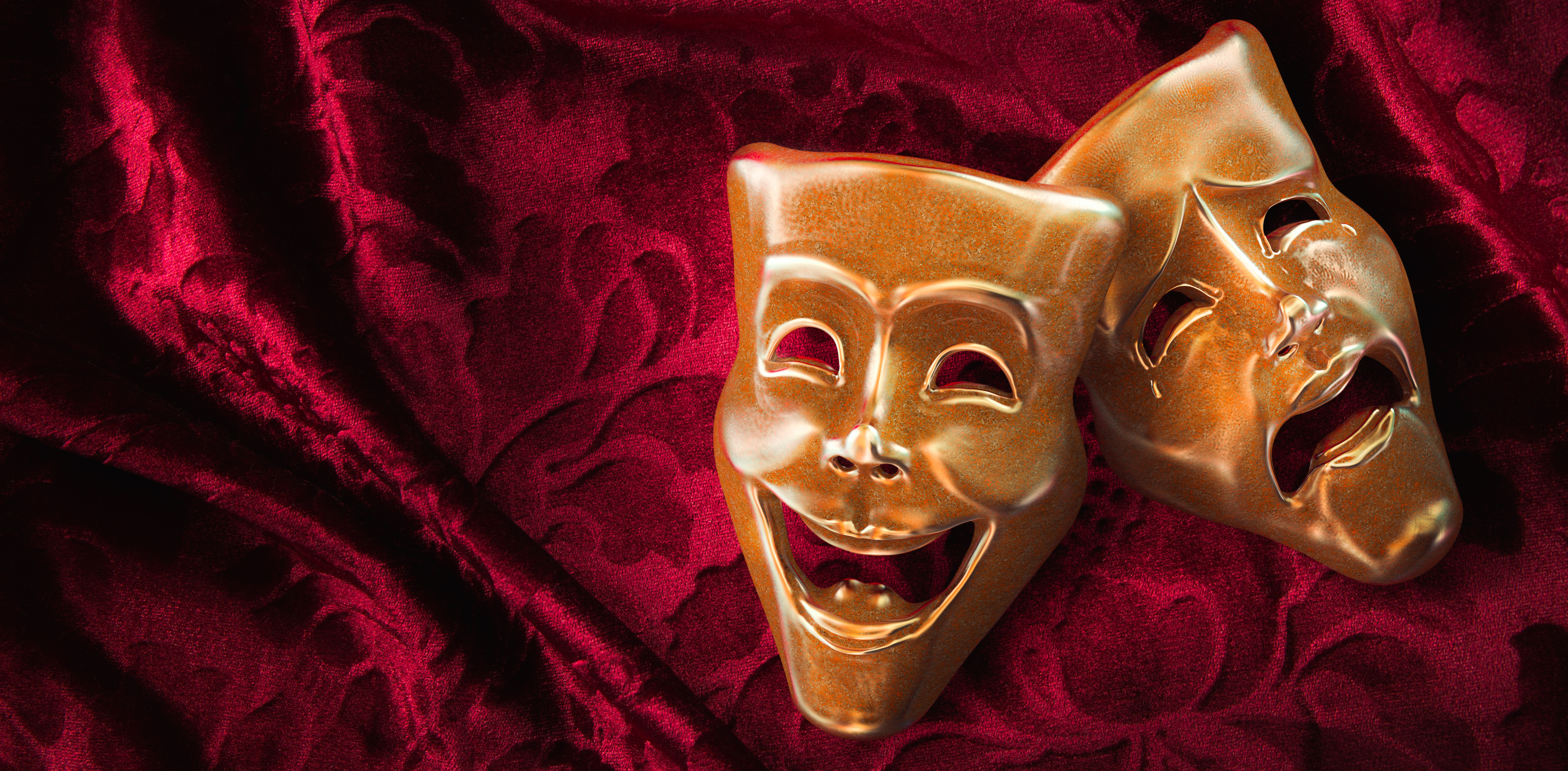Two dramatic masks representing the drama that draws donors in to direct mail fundraising.