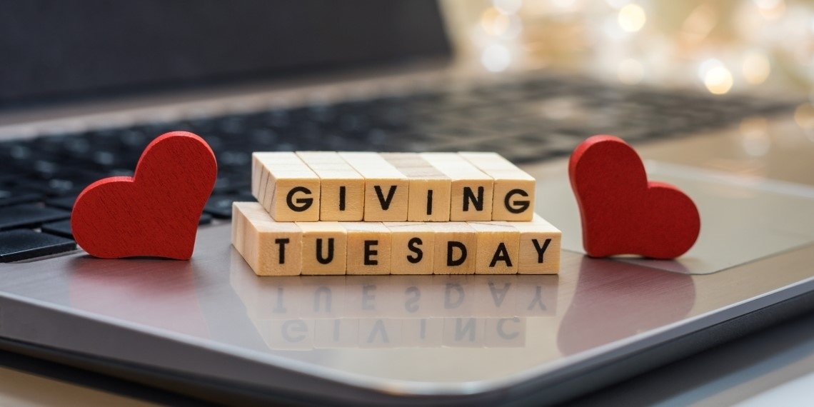 Giving Tuesday written on blocks placed on a laptop
