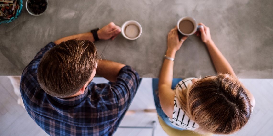 Development officer meeting with a donor over a cup of coffee and getting to know them.