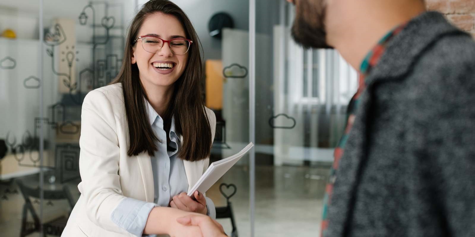 Nonprofit major gifts officer choosing a recruiting partner and shaking his hand