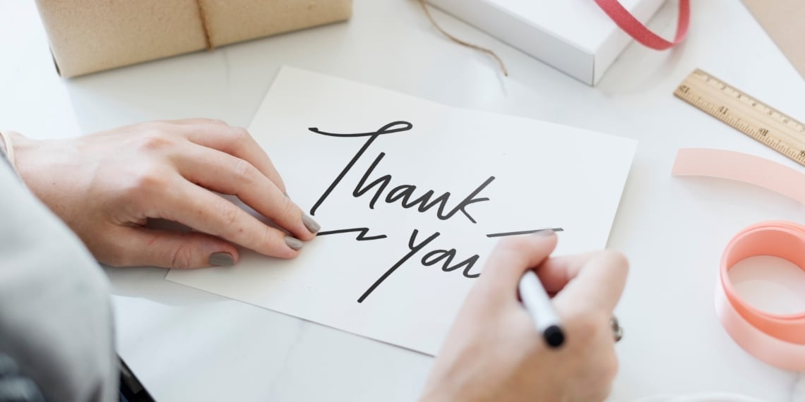 Nonprofit major gifts officer writing a thank you note