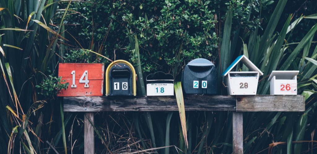 Nonprofits need to avoid shady direct mail fundraising visual of a line of old mailboxes