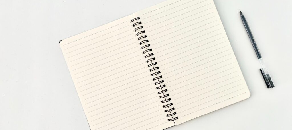 Blank notebook prompting what to place in a donor survey for return fundraising