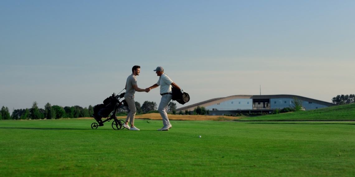 Improving nonprofit donor retention through meaningful connection visual of two men shaking hands at a golf course
